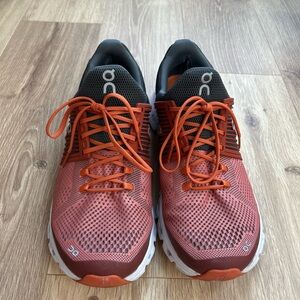 On Running Orange and Black Athletic Shoes